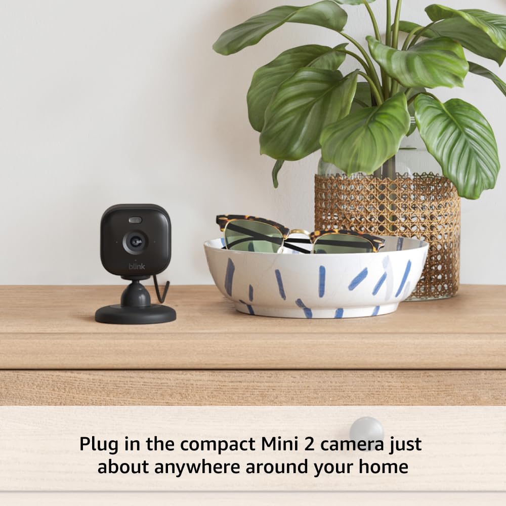 Blink Outdoor 4 + Mini 2 – Wireless smart security camera, two-year battery life, 1080p HD day and infrared night live view. Sync Module Core included – 1 camera system + Mini 2 (Black)