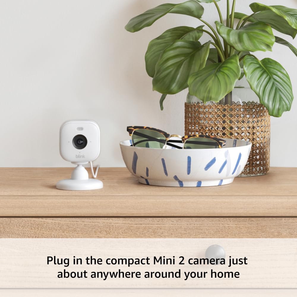 Blink Outdoor 4 + Mini 2 – Wireless smart security camera, two-year battery life, 1080p HD day and infrared night live view. Sync Module Core included – 1 camera system + Mini 2 (Black)